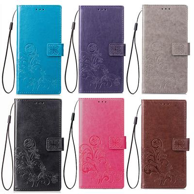 Embossed Lucky Four-Leaf Clover Pattern Shockproof Anti-Scratch PU Leather + Soft TPU Card Slot with Hand Rope Magnetic Buckle and Stand Wallet Case for Xiaomi Redmi 6A